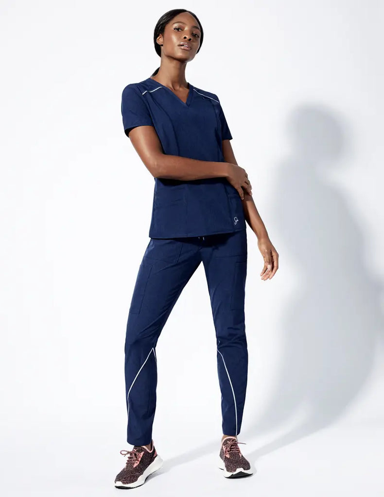 Jaanuu Scrubs Women's Shift V-Neck Top Heathered Navy | scrub-supply.com