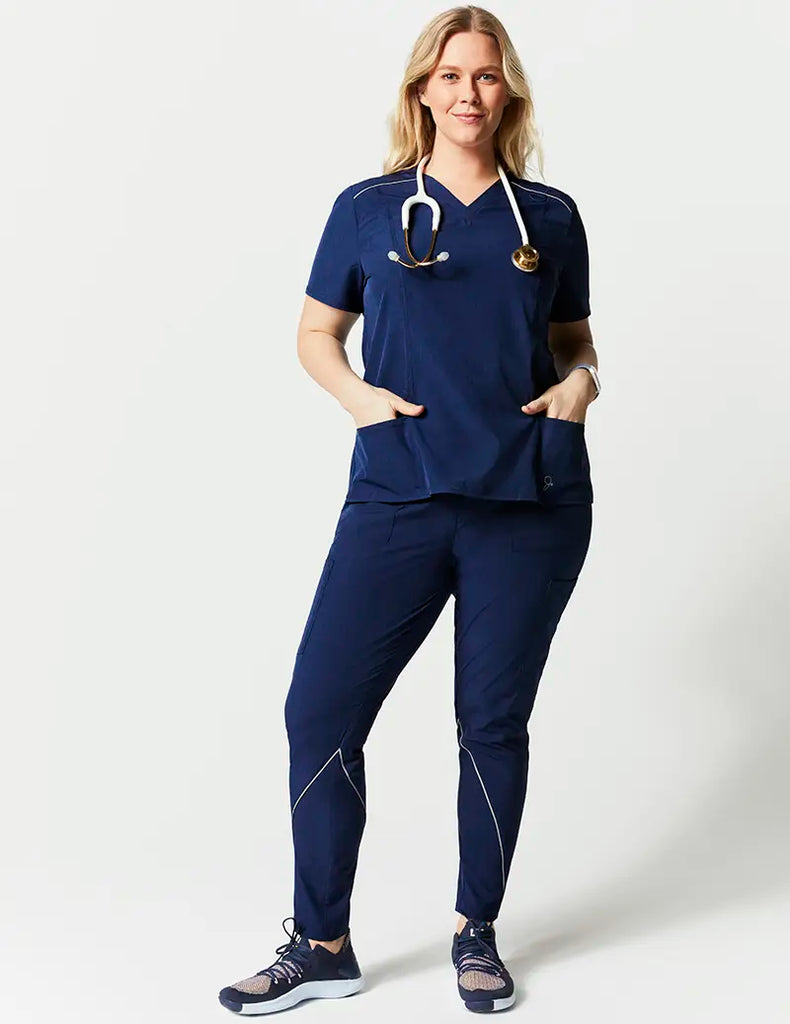 Jaanuu Scrubs Women's Shift V-Neck Top Heathered Navy | scrub-supply.com