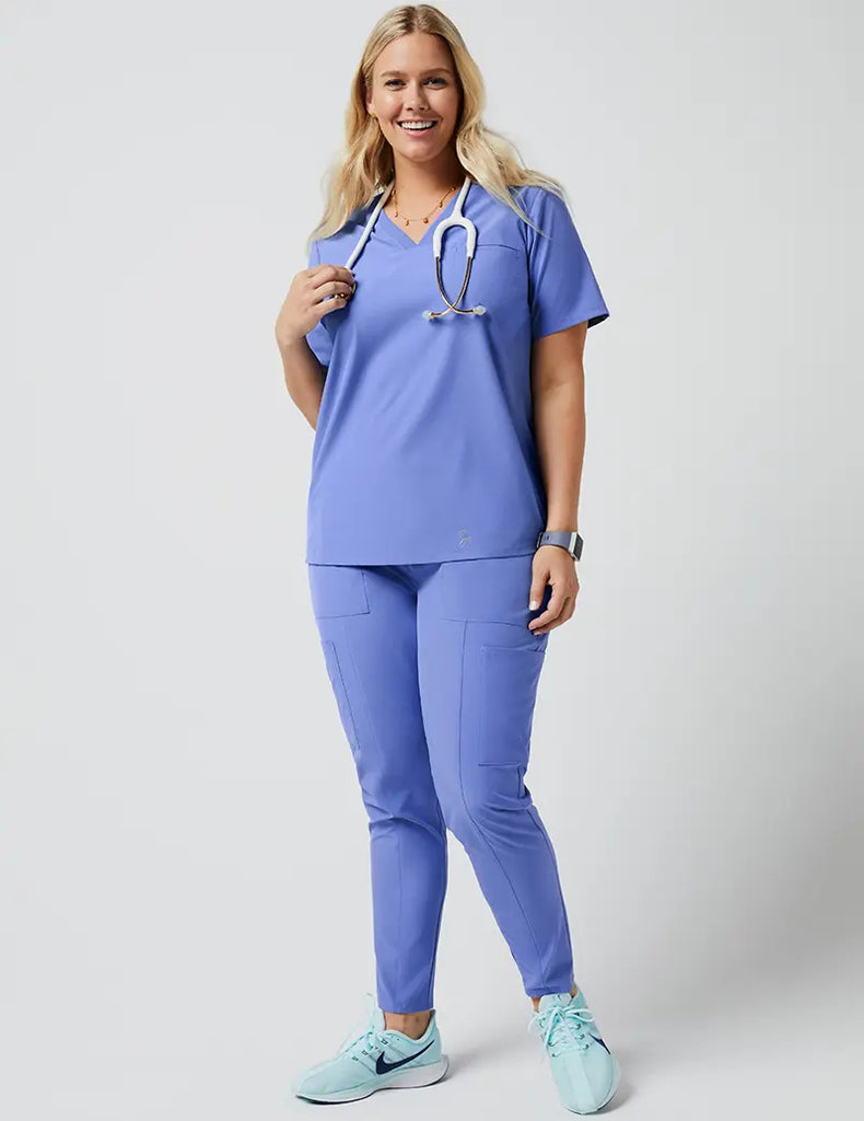 Jaanuu Scrubs Women's Stride Ribbed V-Neck Top Ceil Blue | scrub-supply.com