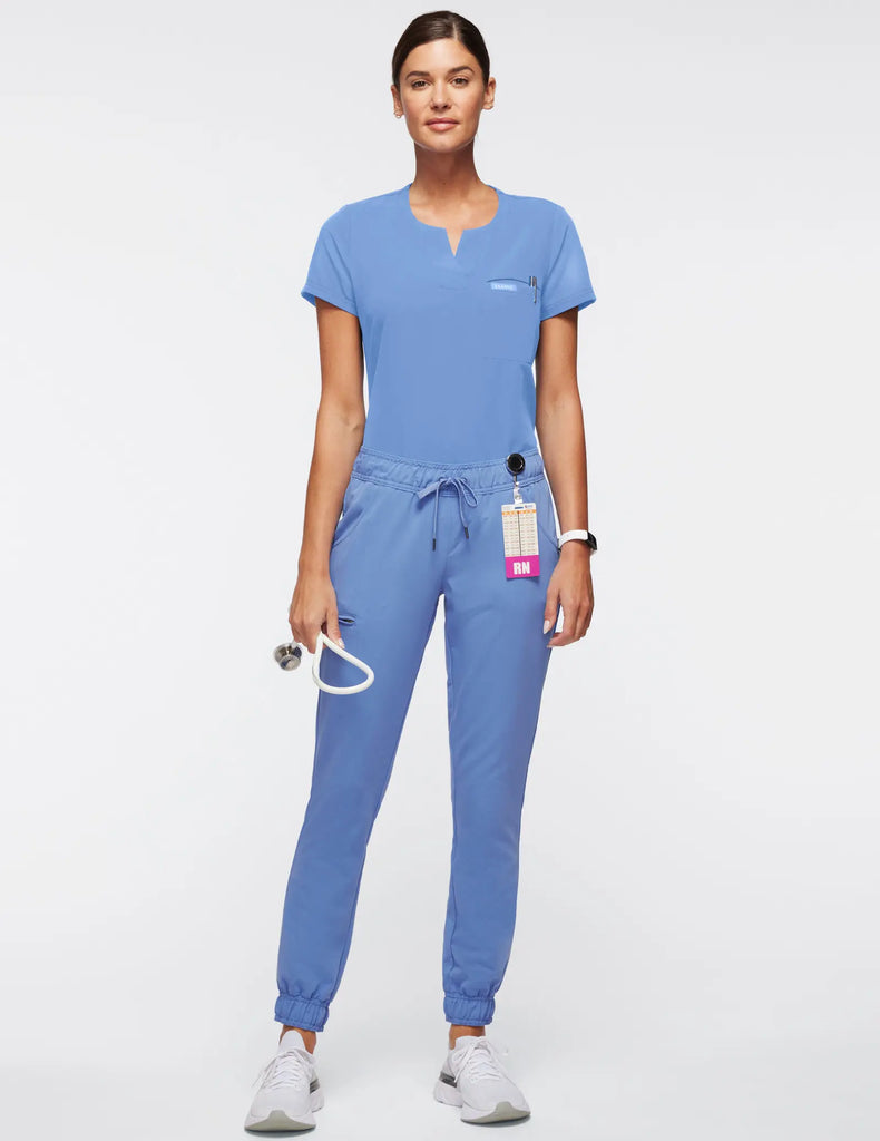 Jaanuu Scrubs Women's 1-Pocket Tuck-In Scrub Top Ceil Blue | scrub-supply.com