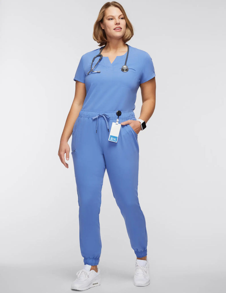 Jaanuu Scrubs Women's 1-Pocket Tuck-In Scrub Top Ceil Blue | scrub-supply.com