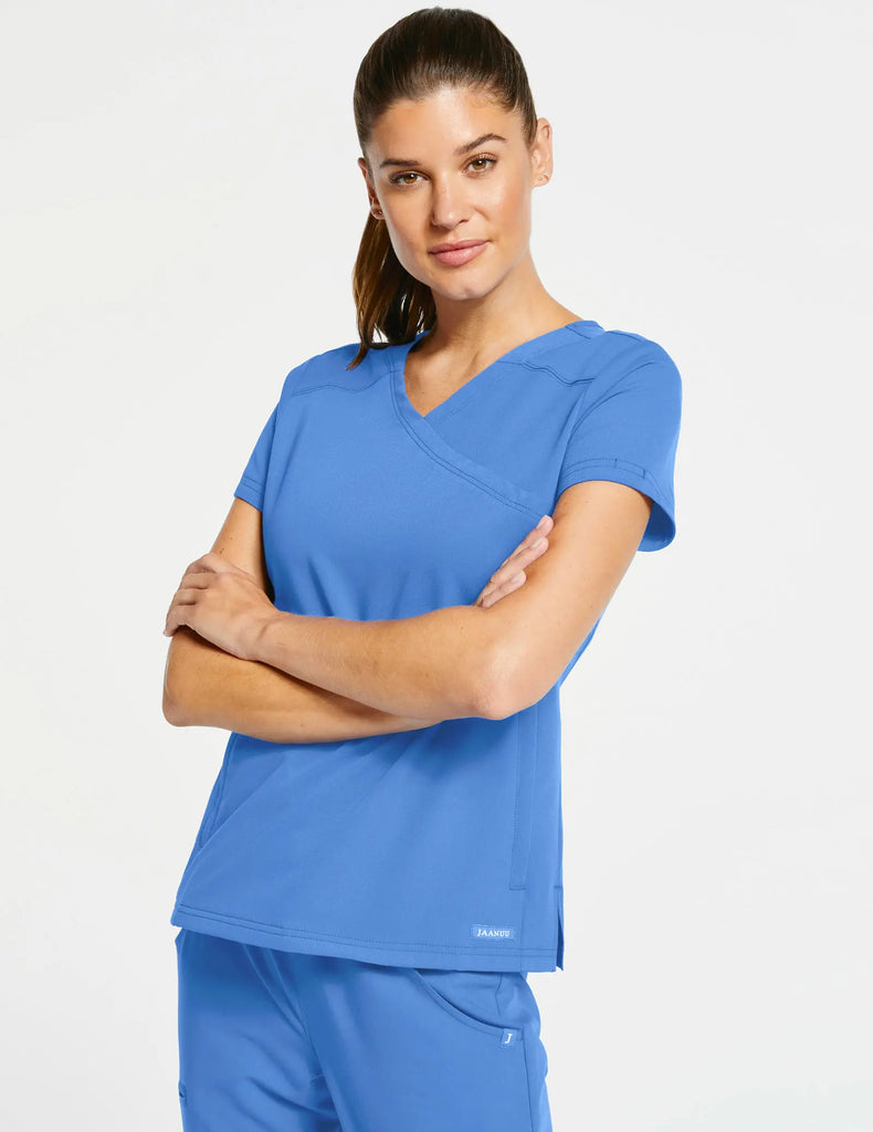 Jaanuu Scrubs Women's 3-Pocket Mock Wrap Top Ceil Blue | scrub-supply.com