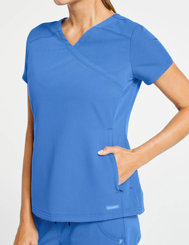 Jaanuu Scrubs Women's 3-Pocket Mock Wrap Top Ceil Blue | scrub-supply.com