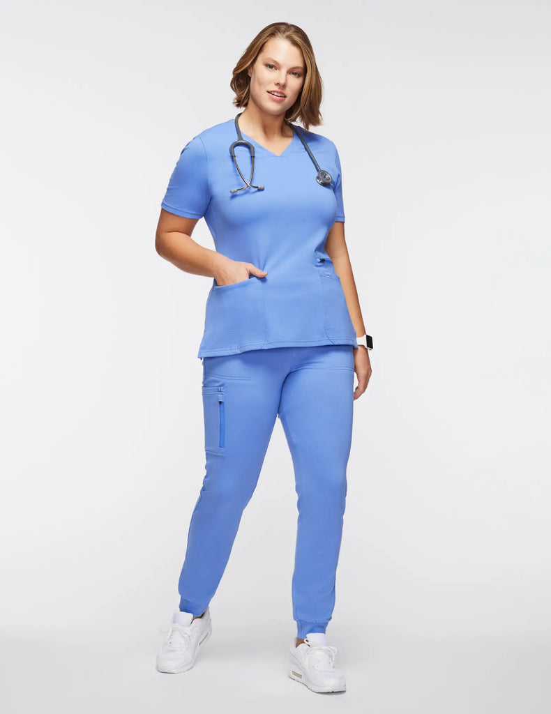 Jaanuu Scrubs Women's 4-Pocket V-Neck Scrub Top Ceil Blue | scrub-supply.com