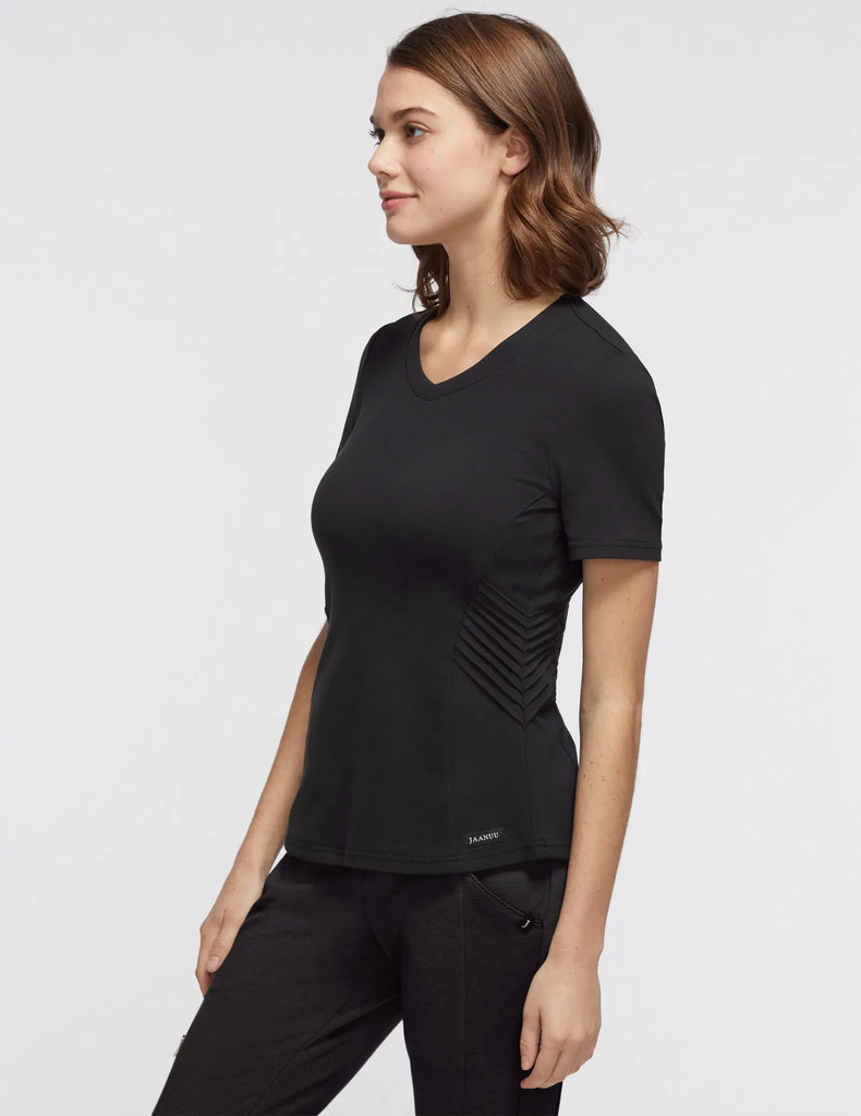 Jaanuu Scrubs Women's Women’s Gold Zip Moto Top Black | scrub-supply.com