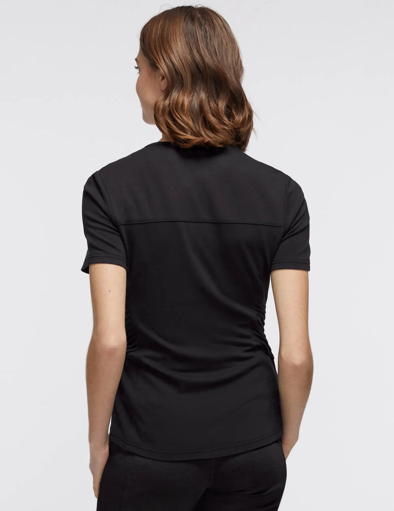 Jaanuu Scrubs Women's Women’s Gold Zip Moto Top Black | scrub-supply.com