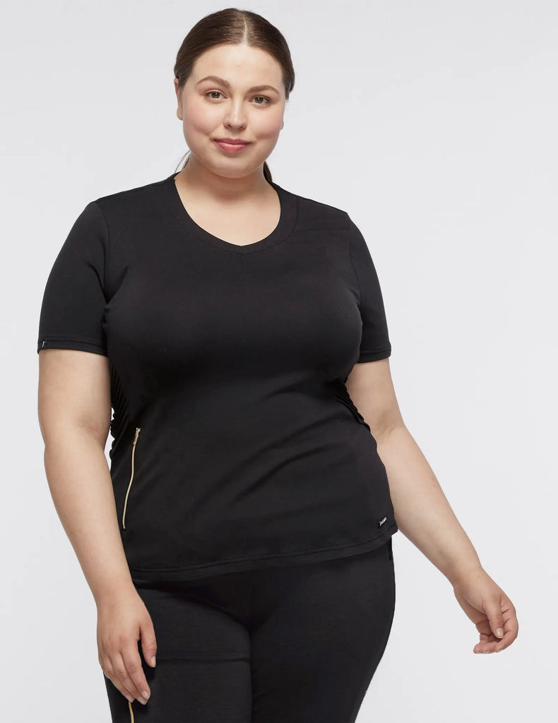 Jaanuu Scrubs Women's Women’s Gold Zip Moto Top Black | scrub-supply.com