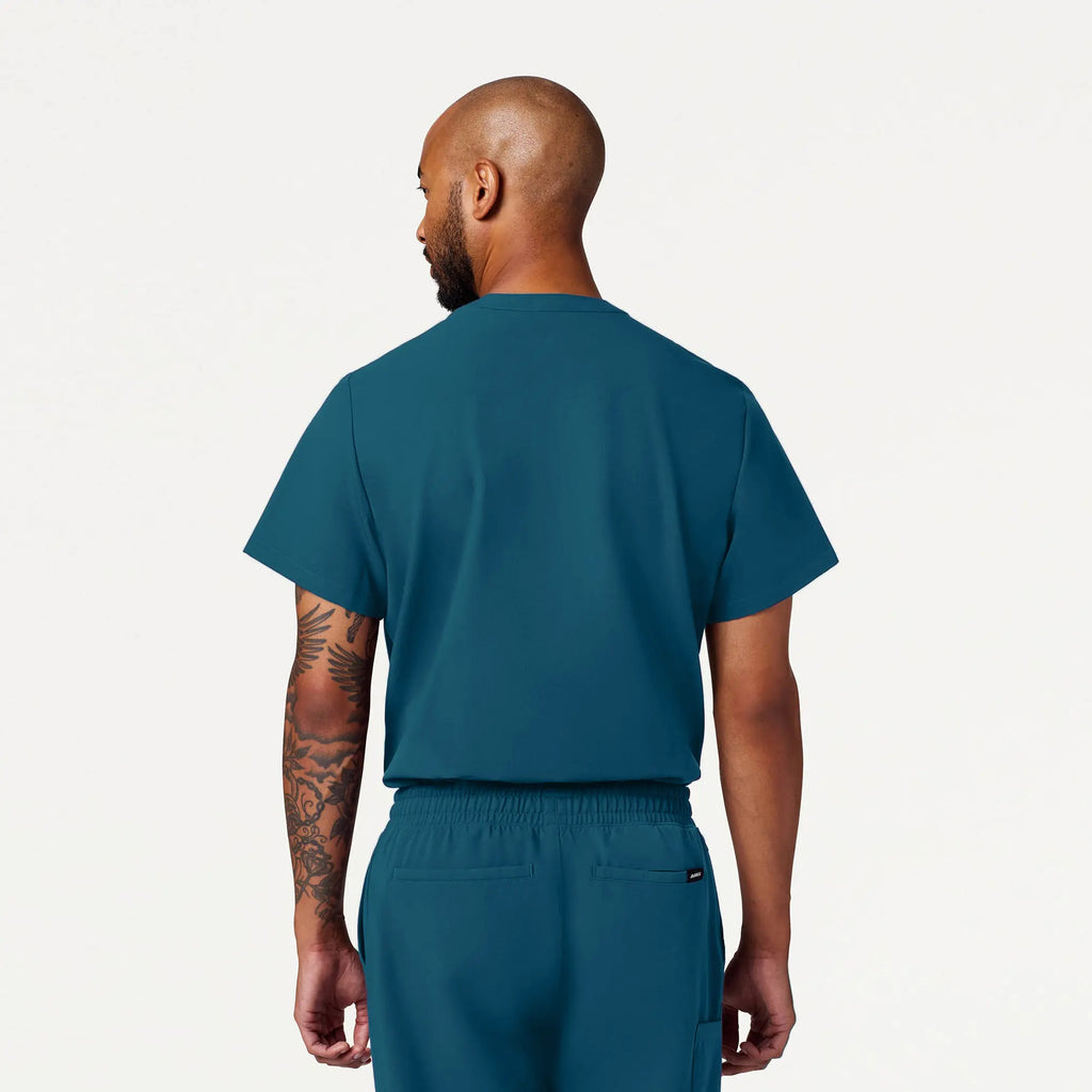 Jaanuu Scrubs Men's Reeve Henley Scrub Top Caribbean Blue | scrub-supply.com