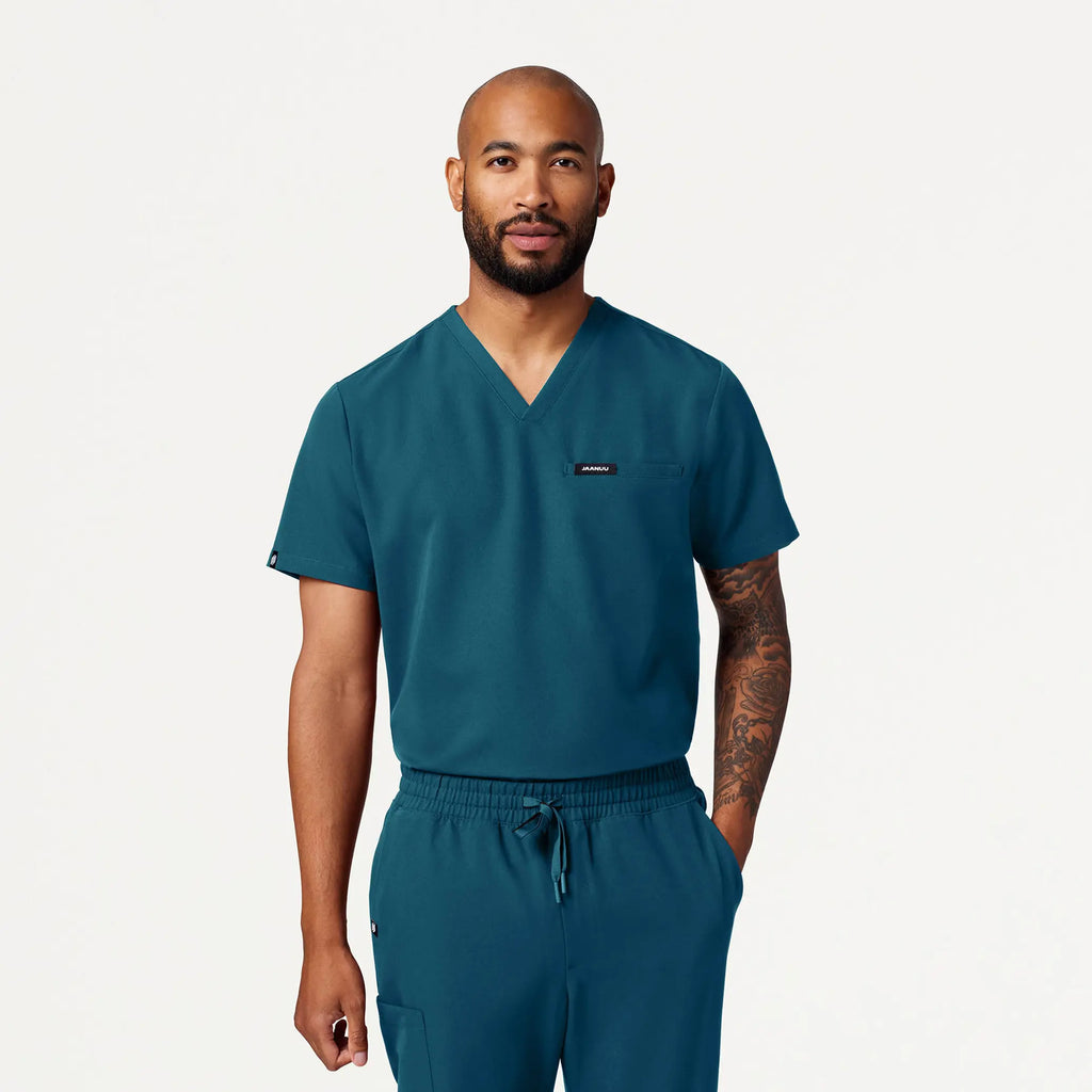 Jaanuu Scrubs Men's Romin 1-Pocket Scrub Top Caribbean Blue | scrub-supply.com