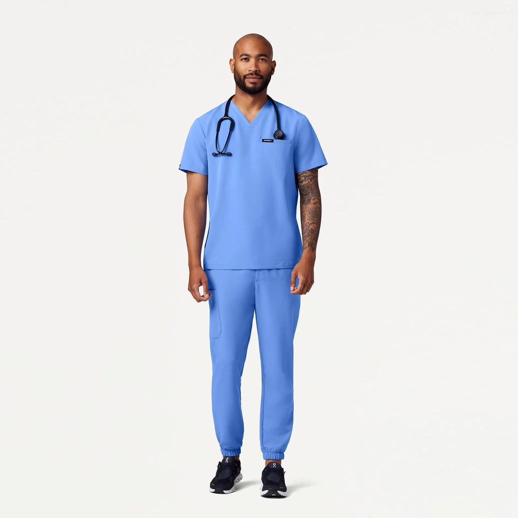 Jaanuu Scrubs Men's Romin 1-Pocket Scrub Top Ceil Blue | scrub-supply.com