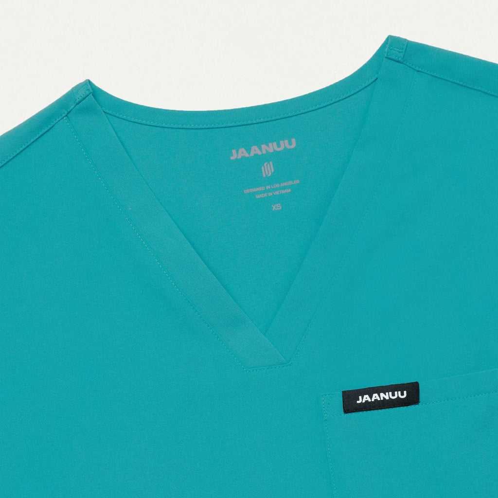 Jaanuu Scrubs Women's Rhena Essential 1-Pocket Scrub Top Aqua | scrub-supply.com