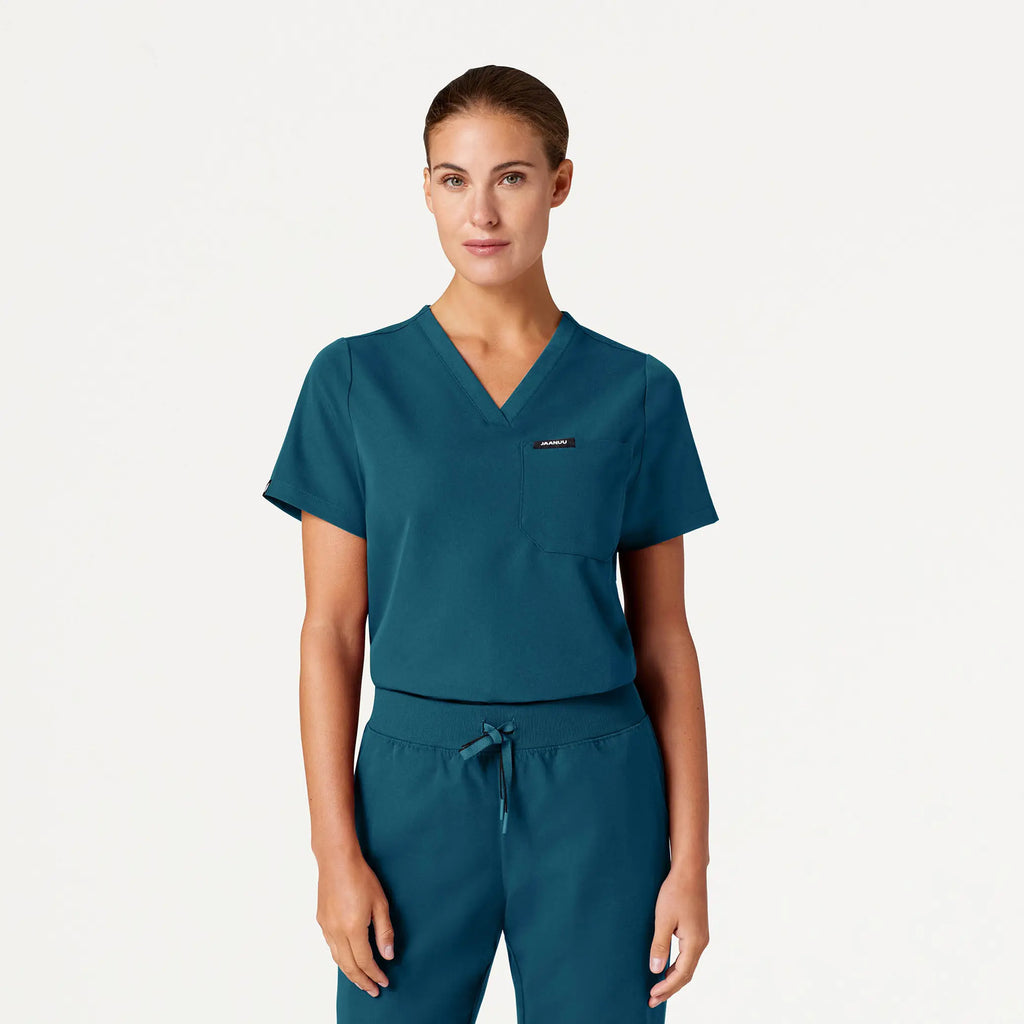 Jaanuu Scrubs Women's Rhena Essential 1-Pocket Scrub Top Caribbean Blue | scrub-supply.com