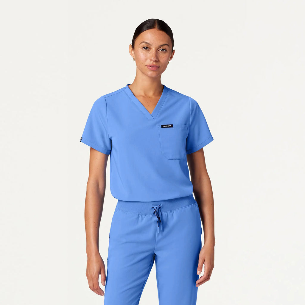 Jaanuu Scrubs Women's Rhena Essential 1-Pocket Scrub Top Ceil Blue | scrub-supply.com