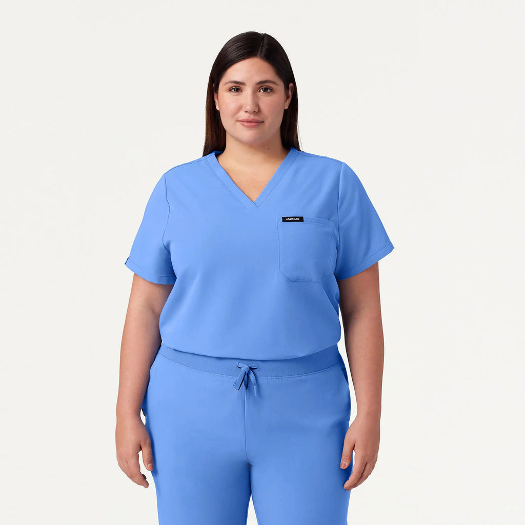 Jaanuu Scrubs Women's Rhena Essential 1-Pocket Scrub Top Ceil Blue | scrub-supply.com