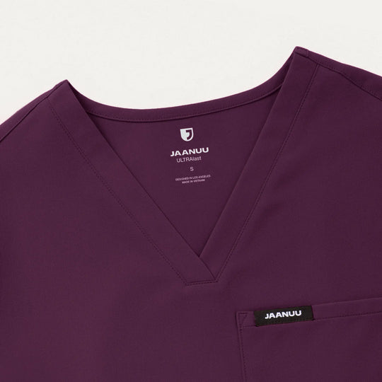 Jaanuu Scrubs Women's Rhena Essential 1-Pocket Scrub Top Deep Eggplant | scrub-supply.com