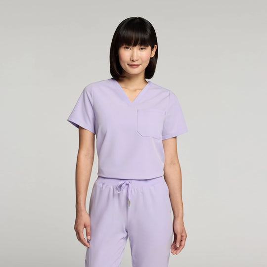 Jaanuu Scrubs Women's Rhena Essential 1-Pocket Scrub Top Lavender | scrub-supply.com