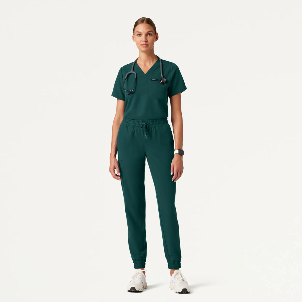 Jaanuu Scrubs Women's Rhena Essential 1-Pocket Scrub Top Midnight Green | scrub-supply.com