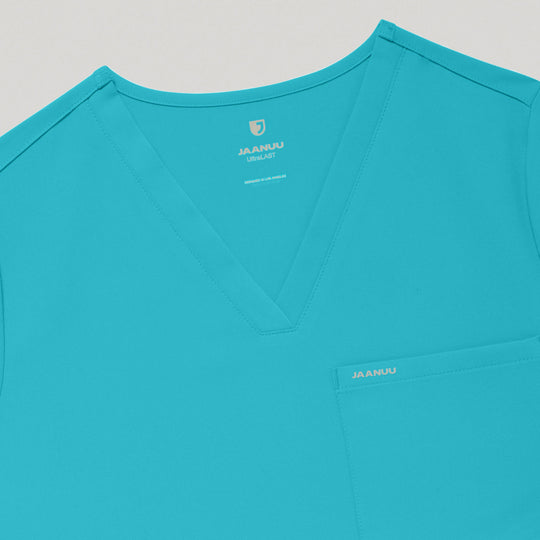 Jaanuu Scrubs Women's Rhena 1-Pocket Scrub Top Marina | scrub-supply.com