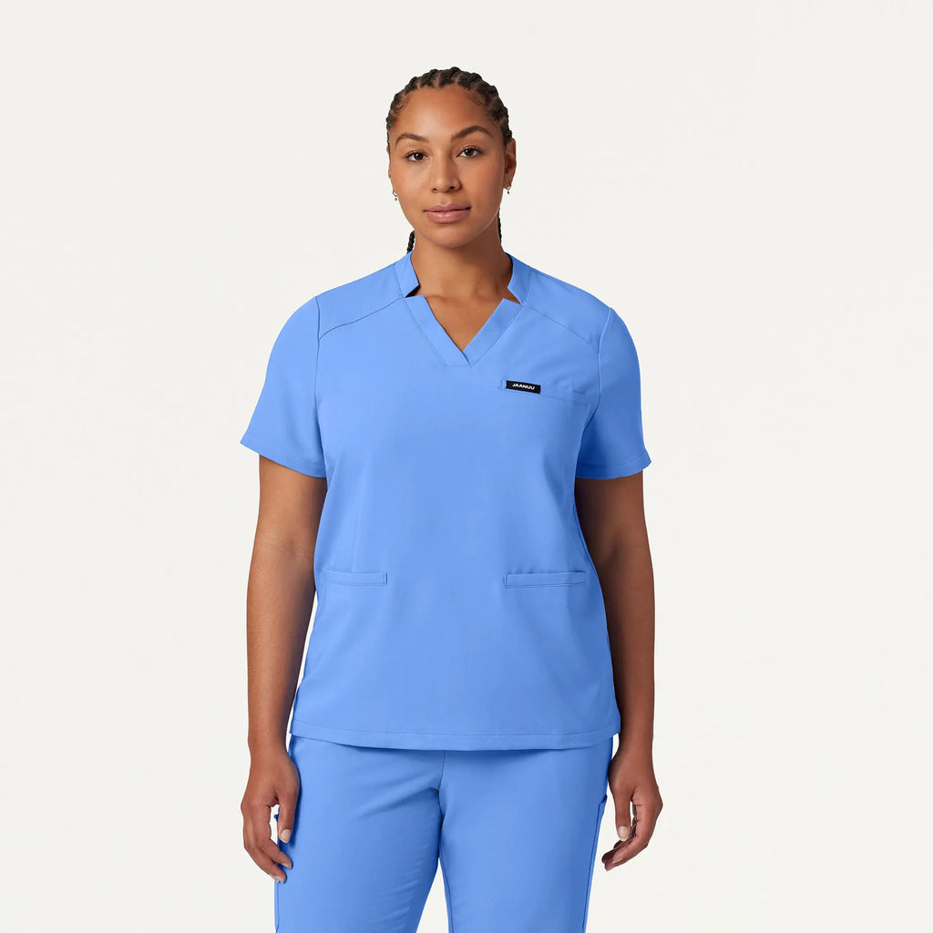 Jaanuu Scrubs Women's Helia Notched V-Neck Scrub Top Ceil Blue | scrub-supply.com