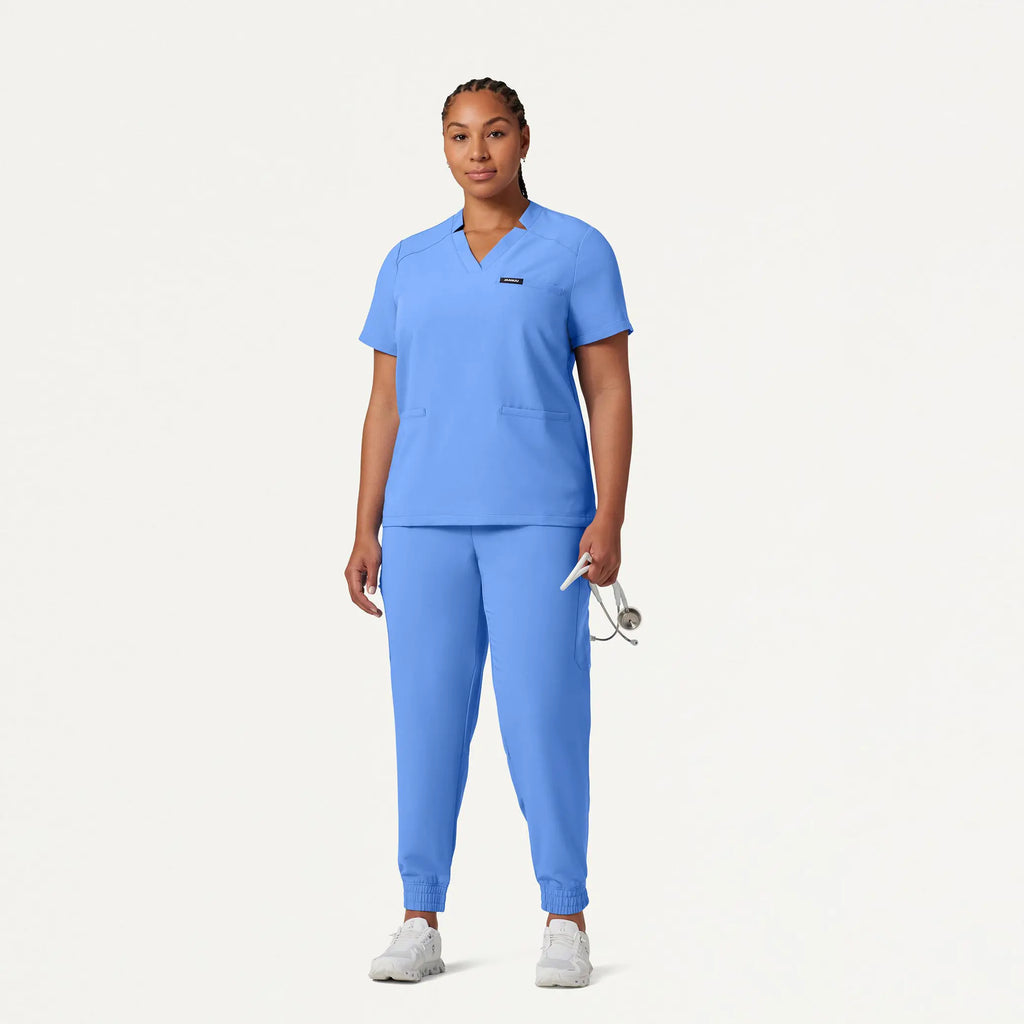 Jaanuu Scrubs Women's Helia Notched V-Neck Scrub Top Ceil Blue | scrub-supply.com