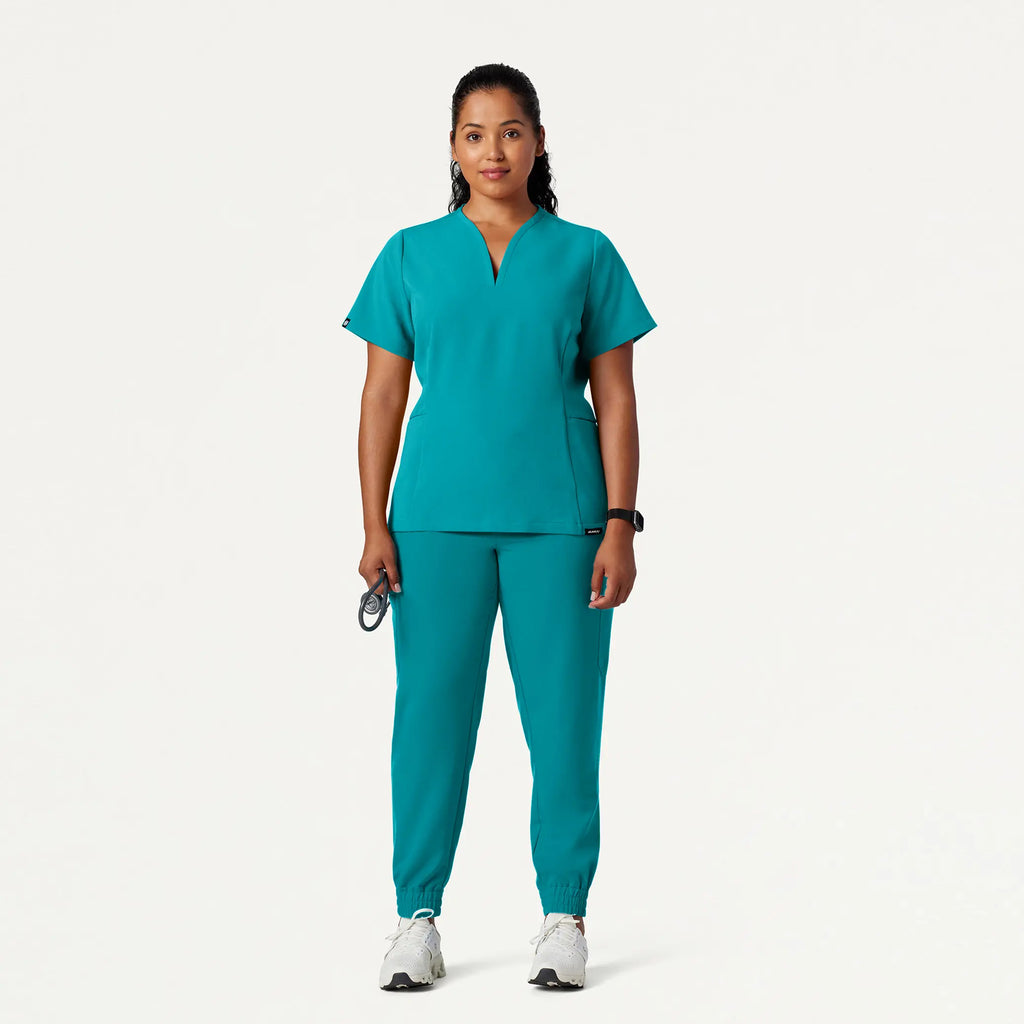 Jaanuu Scrubs Women's Calix Fit & Flare Scrub Top Aqua | scrub-supply.com