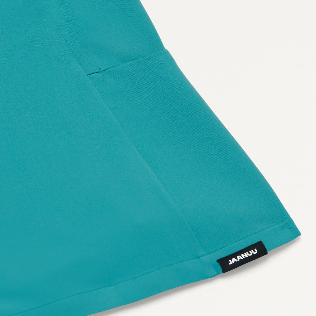 Jaanuu Scrubs Women's Calix Fit & Flare Scrub Top Aqua | scrub-supply.com