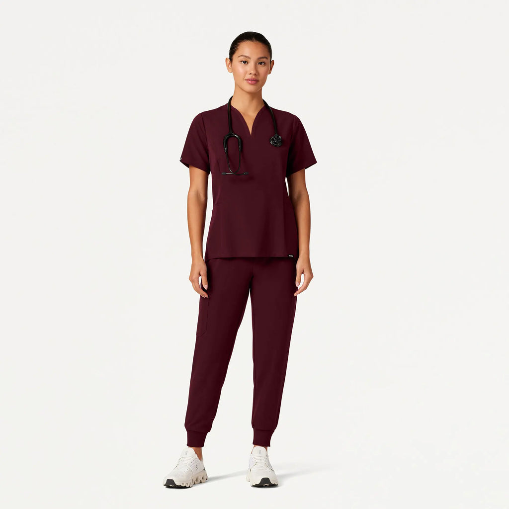 Jaanuu Scrubs Women's Calix Fit & Flare Scrub Top Burgundy | scrub-supply.com