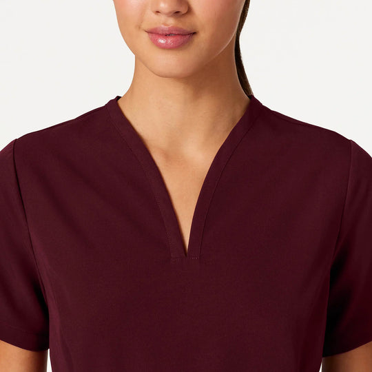 Jaanuu Scrubs Women's Calix Fit & Flare Scrub Top Burgundy | scrub-supply.com