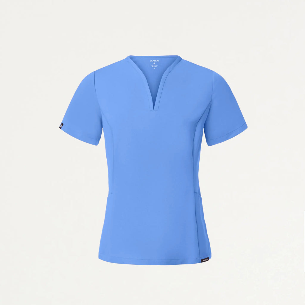 Jaanuu Scrubs Women's Calix Fit & Flare Scrub Top Ceil Blue | scrub-supply.com