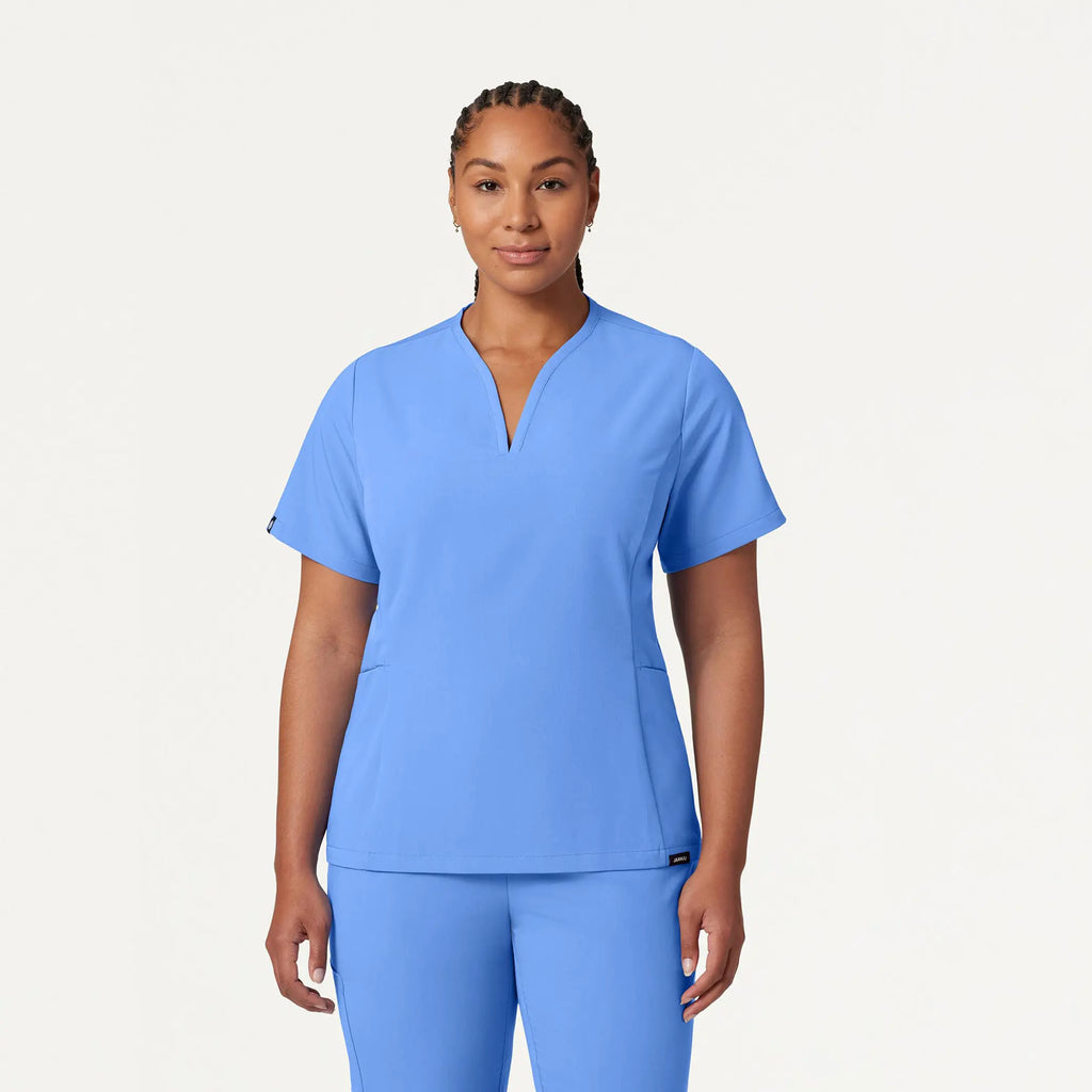 Jaanuu Scrubs Women's Calix Fit & Flare Scrub Top Ceil Blue | scrub-supply.com