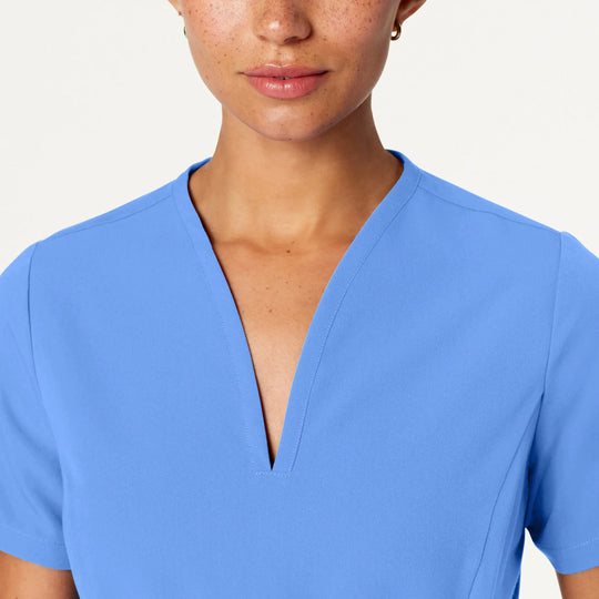 Jaanuu Scrubs Women's Calix Fit & Flare Scrub Top Ceil Blue | scrub-supply.com