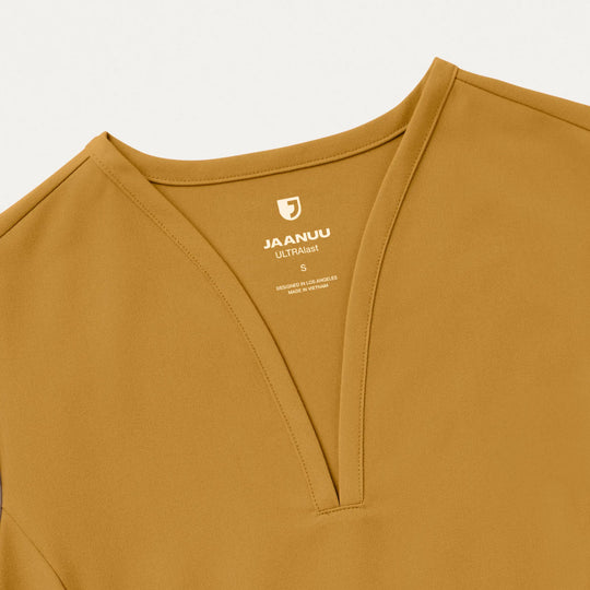 Jaanuu Scrubs Women's Calix Fit & Flare Scrub Top Cider | scrub-supply.com