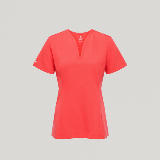 Jaanuu Scrubs Women's Calix Fit & Flare Scrub Top Coral | scrub-supply.com