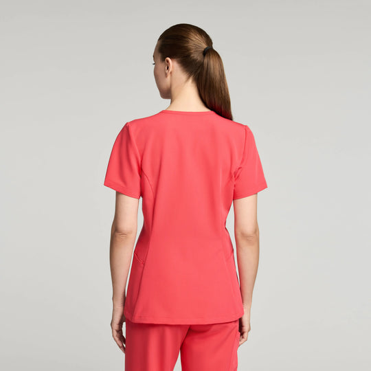 Jaanuu Scrubs Women's Calix Fit & Flare Scrub Top Coral | scrub-supply.com