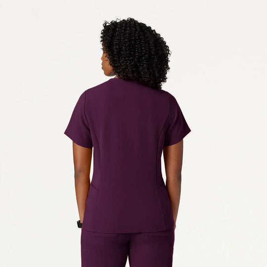 Jaanuu Scrubs Women's Calix Fit & Flare Scrub Top Deep Eggplant | scrub-supply.com