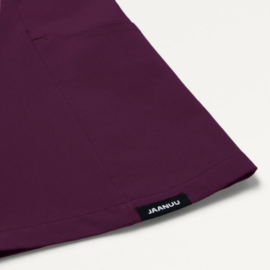 Jaanuu Scrubs Women's Calix Fit & Flare Scrub Top Deep Eggplant | scrub-supply.com