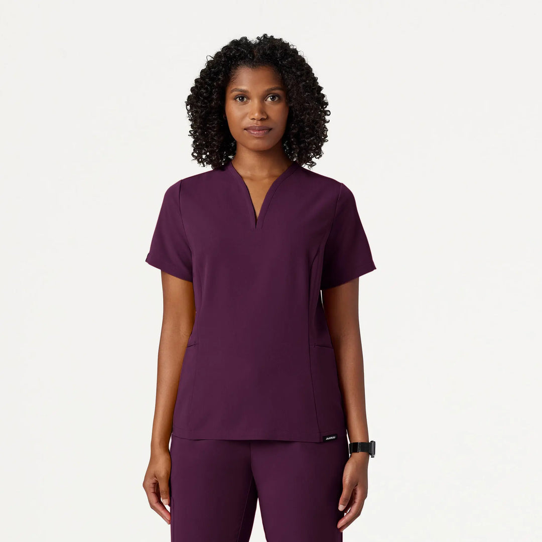 Jaanuu Scrubs Women's Calix Fit & Flare Scrub Top Deep Eggplant | scrub-supply.com
