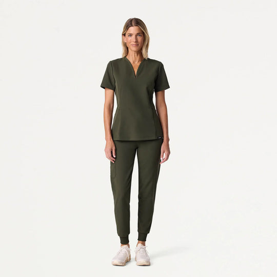 Jaanuu Scrubs Women's Calix Fit & Flare Scrub Top Deep Olive | scrub-supply.com