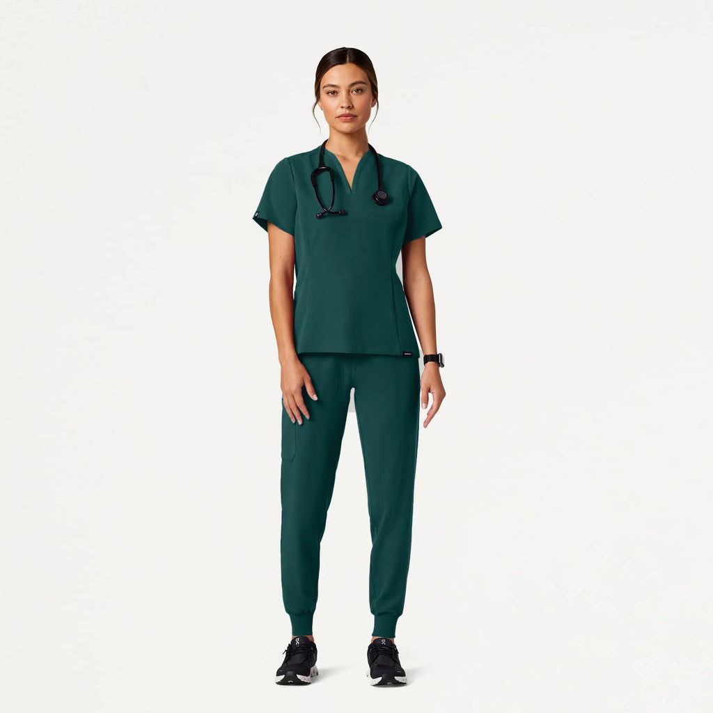 Jaanuu Scrubs Women's Calix Fit & Flare Scrub Top Midnight Green | scrub-supply.com