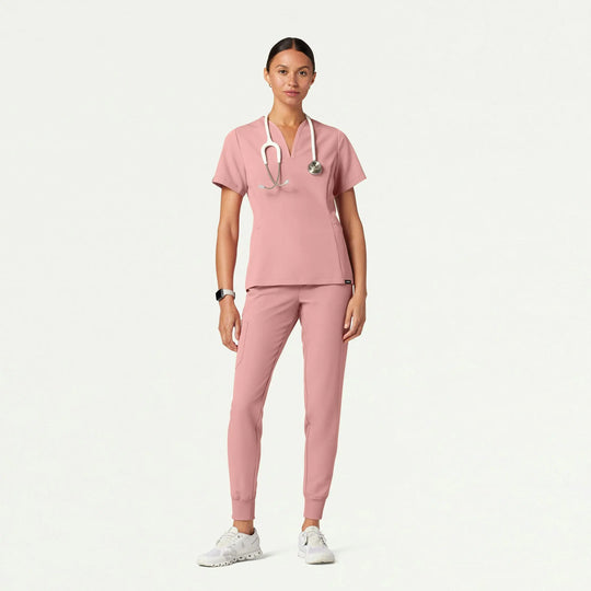 Jaanuu Scrubs Women's Calix Fit & Flare Scrub Top Mauve | scrub-supply.com