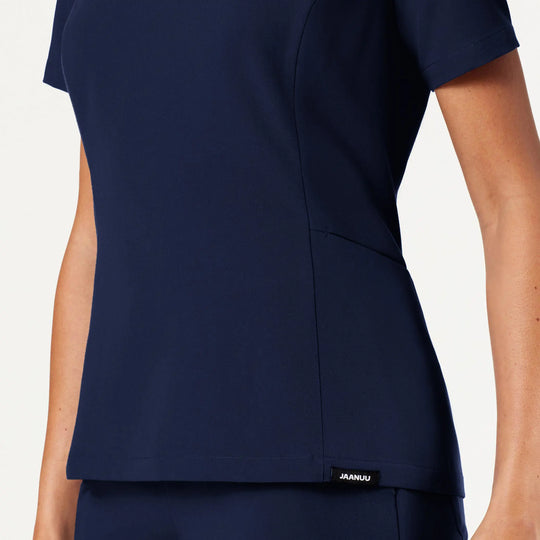Jaanuu Scrubs Women's Calix Fit & Flare Scrub Top Midnight Navy | scrub-supply.com