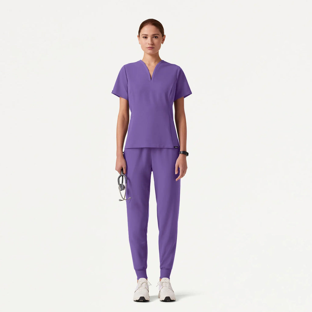 Jaanuu Scrubs Women's Calix Fit & Flare Scrub Top Violet | scrub-supply.com