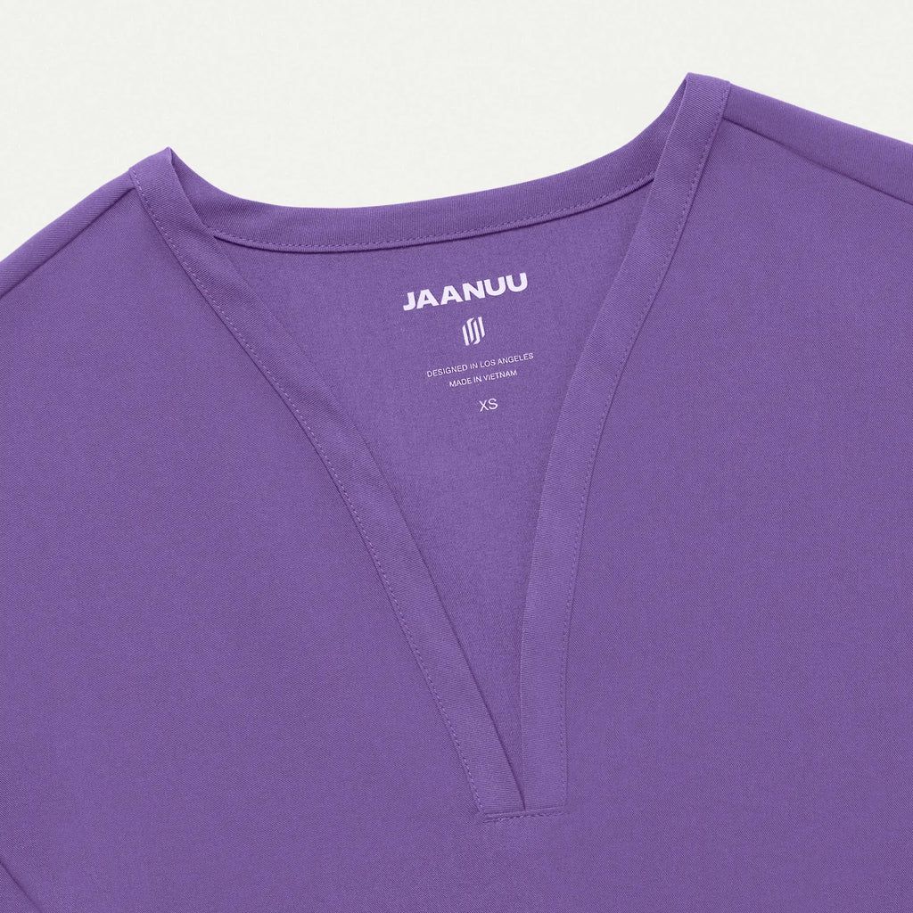 Jaanuu Scrubs Women's Calix Fit & Flare Scrub Top Violet | scrub-supply.com