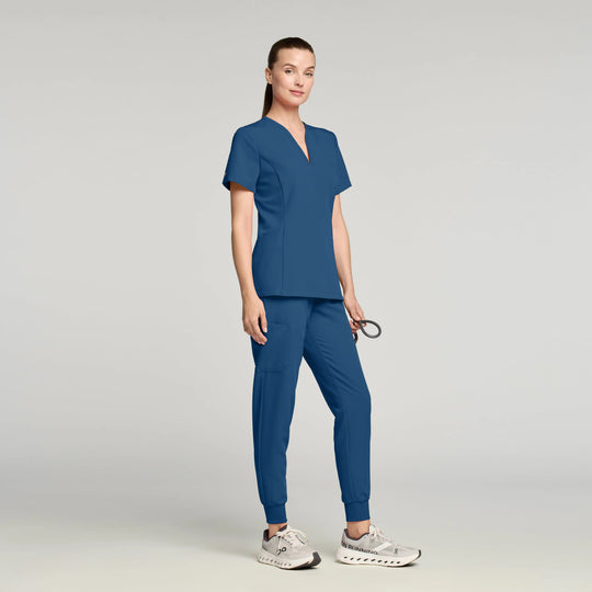 Jaanuu Scrubs Women's Calix Fit & Flare Scrub Top Ocean | scrub-supply.com