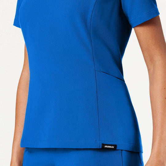 Jaanuu Scrubs Women's Calix Fit & Flare Scrub Top Royal Blue | scrub-supply.com