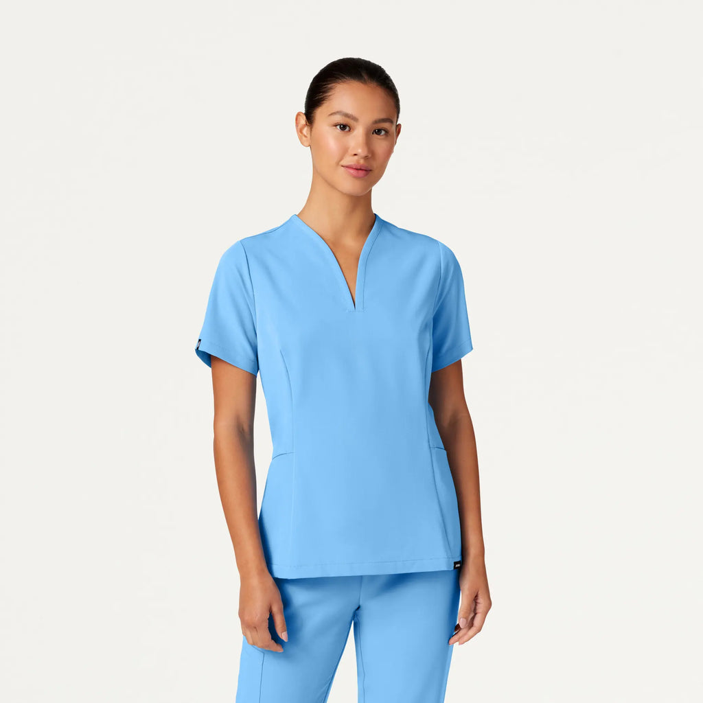 Jaanuu Scrubs Women's Calix Fit & Flare Scrub Top Sky Blue | scrub-supply.com