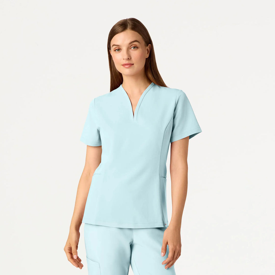 Jaanuu Scrubs Women's Calix Fit & Flare Scrub Top Sky Blue | scrub-supply.com