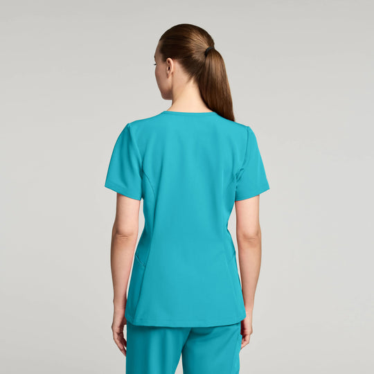Jaanuu Scrubs Women's Calix Fit & Flare Scrub Top Marina | scrub-supply.com