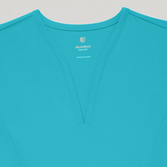 Jaanuu Scrubs Women's Calix Fit & Flare Scrub Top Marina | scrub-supply.com