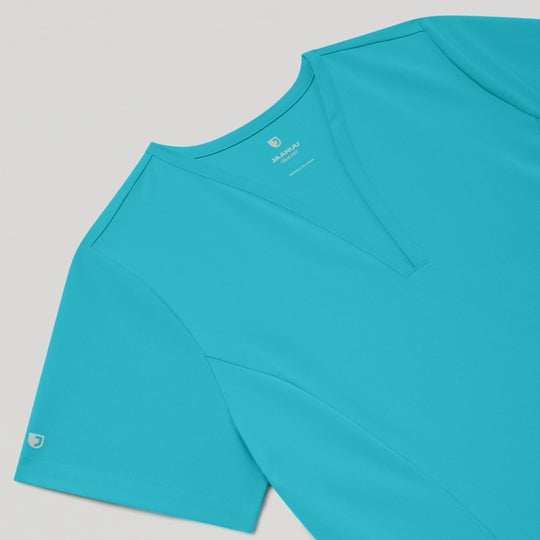 Jaanuu Scrubs Women's Calix Fit & Flare Scrub Top Marina | scrub-supply.com